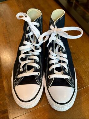 Converse High-Top Sneakers in Black and White. Size 9 women’s. Size 7 men’s.